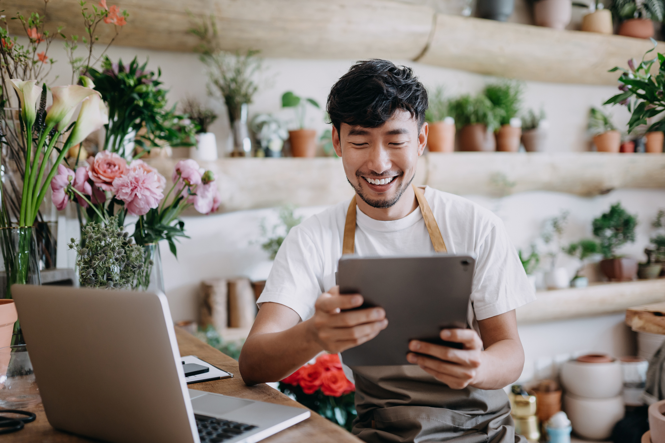 Business owner reviewing email security on tablet