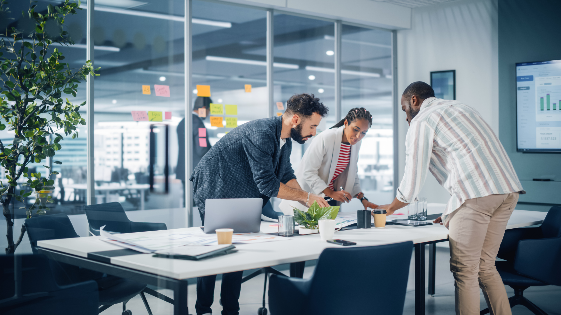 Team reviewing IT infrastructure in a modern office